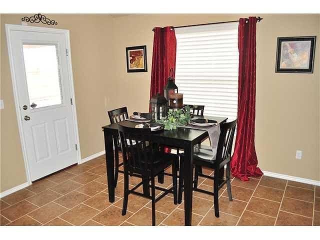 Dining area with a table set for four