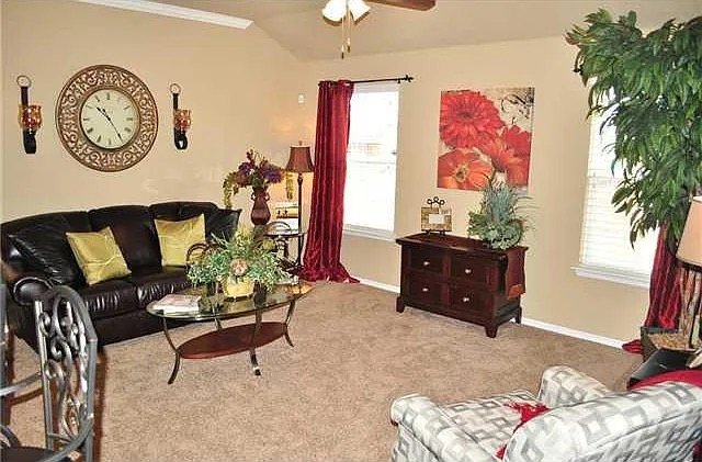 A bright, comfortably furnished living room at Our Place